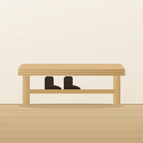 Un banc en chêne blanc avec une tablette en dessous pour les bottes