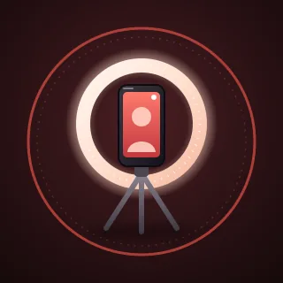 A phone on a small tripod inside a glowing ring light, inside a ring