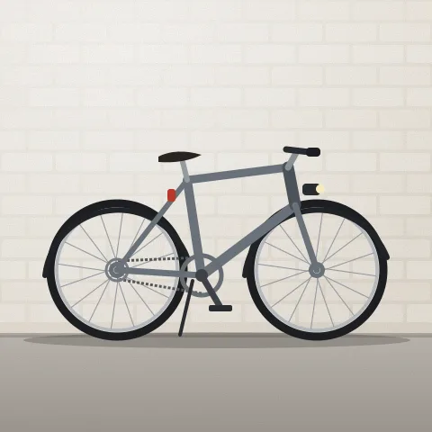 A grey hybrid bike with black mudguards and a front light, side on