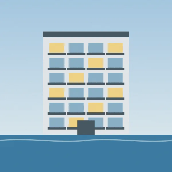 A modern apartment building with balconies over the water
