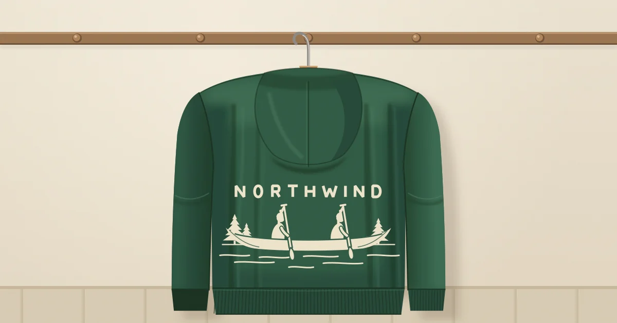 A forest green hoodie on a hanger, seen from the back, with a canoe and NORTHWIND printed on it