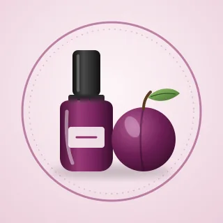 A bottle of plum nail polish beside a ripe plum with a green leaf, inside a ring